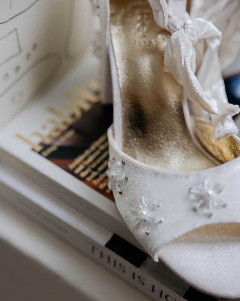 White velvet bridal shoes with pearl flowers