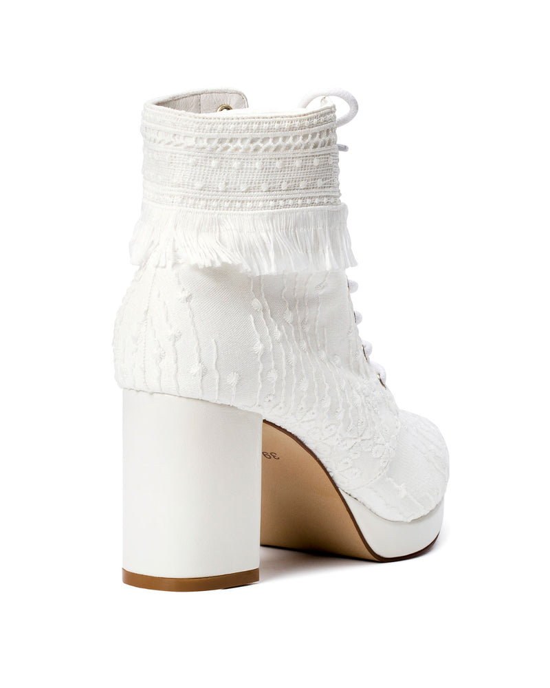 Bohemian bridal boots with laces and fringe