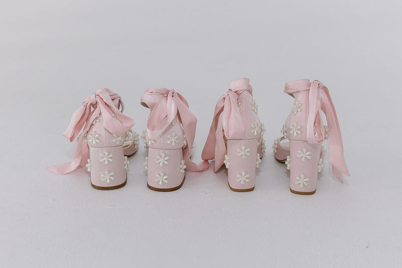 Pink satin bridal shoes with pearl daisy flowers