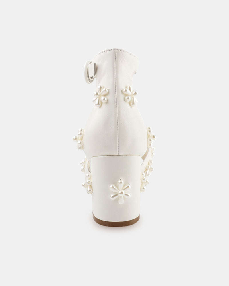 White boot with floral embellishments on a white background