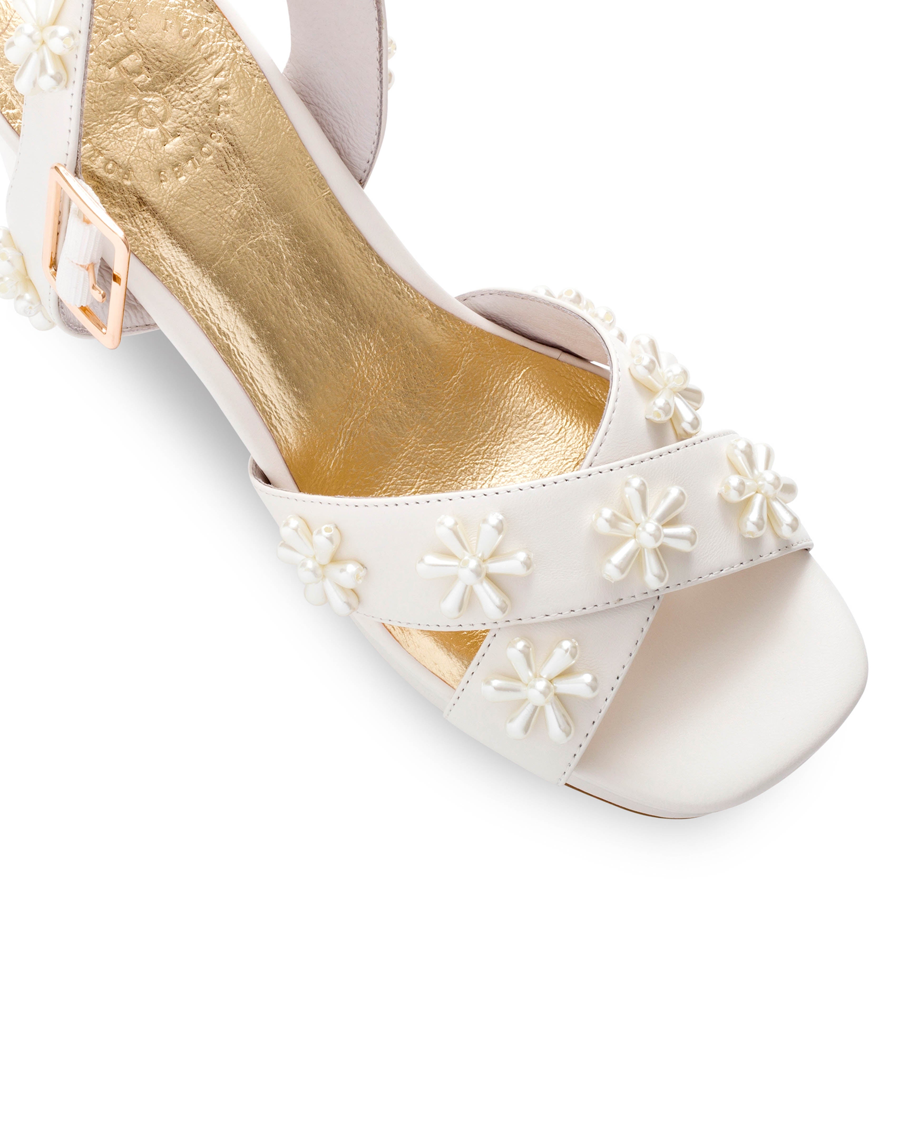 Ivory leather platform bridal shoes with pearl flowers