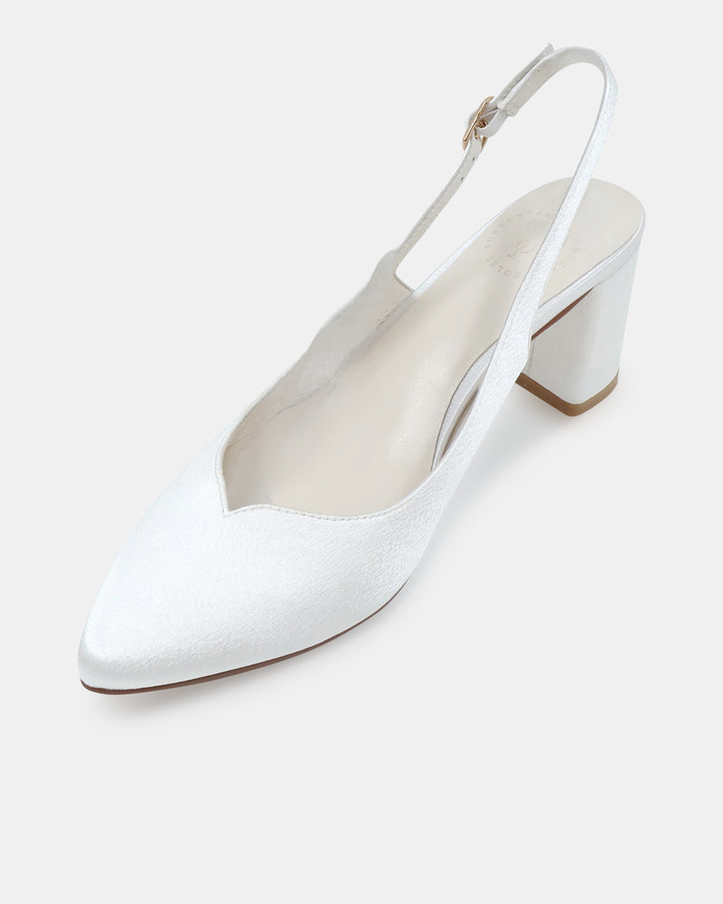 White high-heeled closed toe shoe on a white background