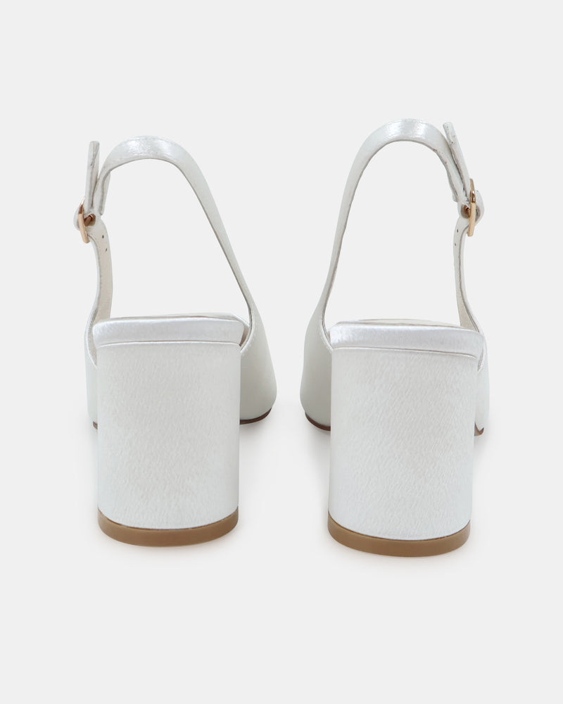 White high-heeled closed toe shoe on a white background