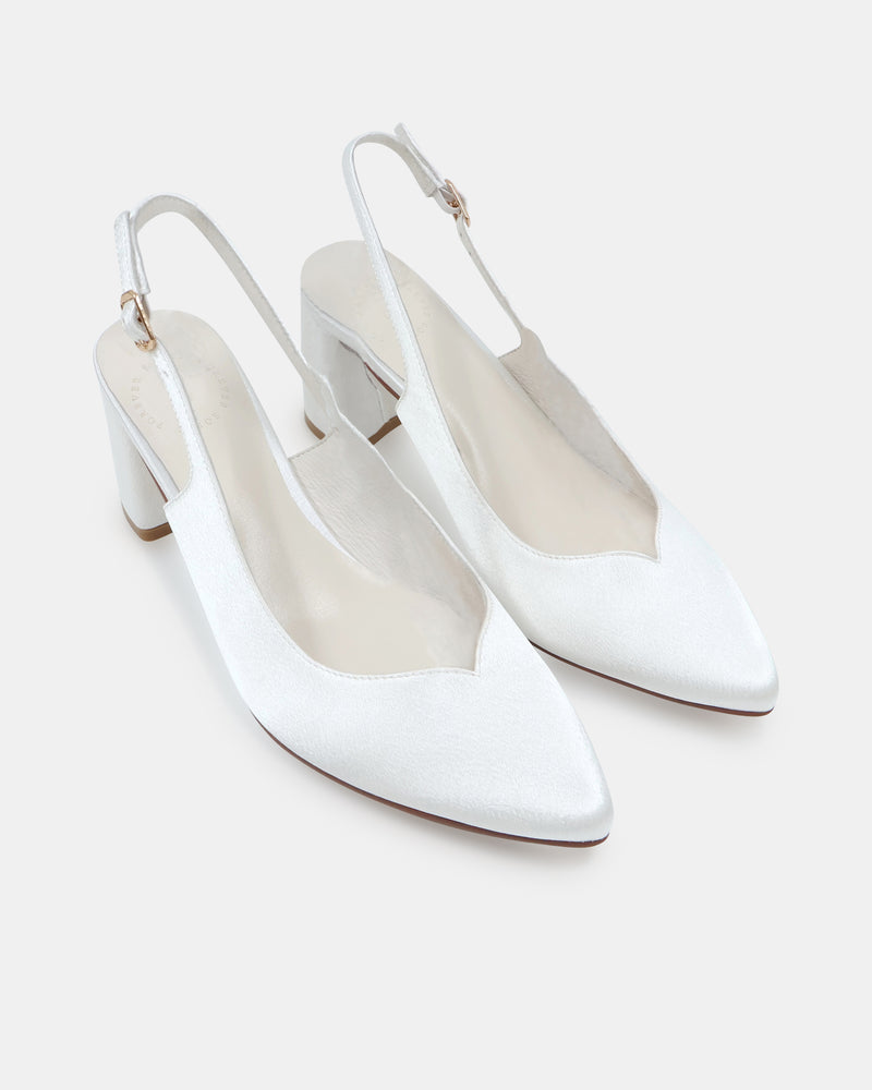 White high-heeled closed toe shoe on a white background