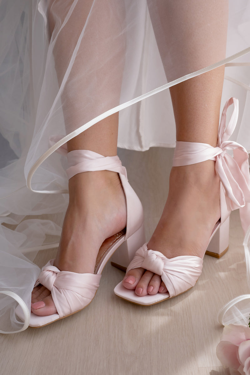 Pink satin bridal shoes with bow ties