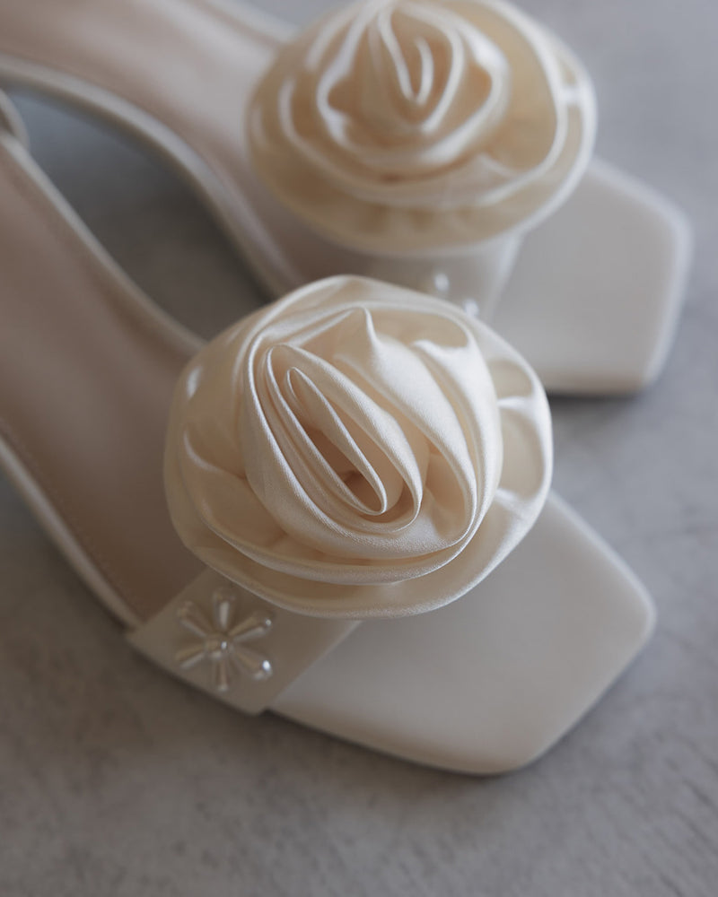 Ivory satin clip on rosette flowers
