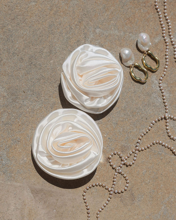 Ivory satin clip on rosette flowers