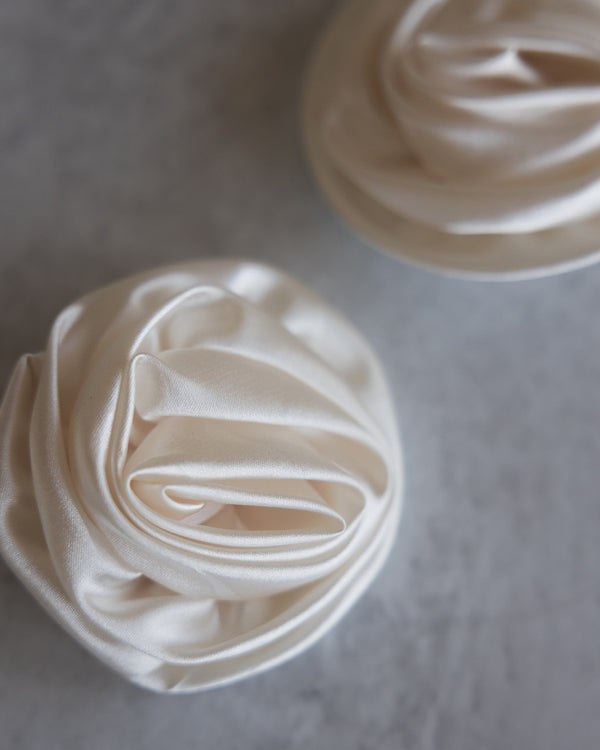 Ivory satin clip on rosette flowers