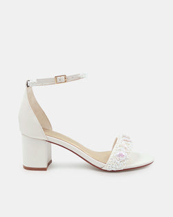 White sandal with block heel on a white background