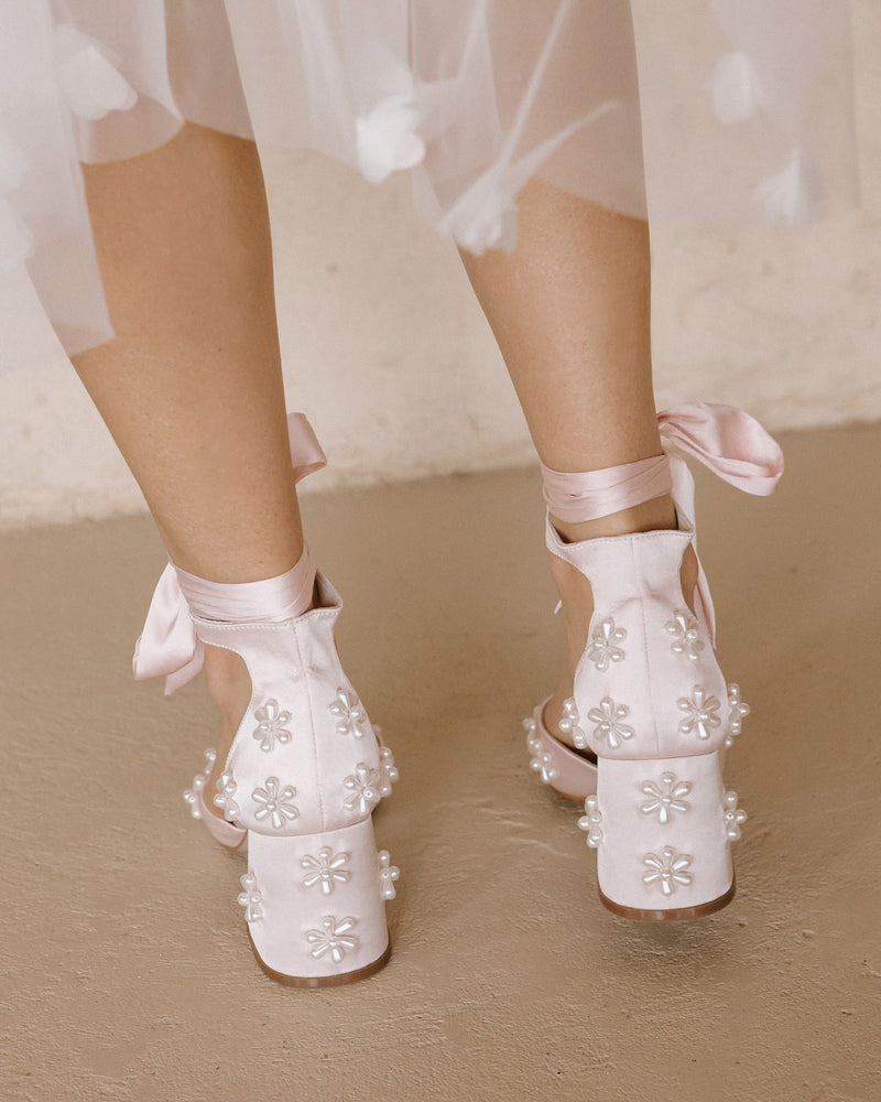 Pink satin bridal shoes with pearl daisy flowers