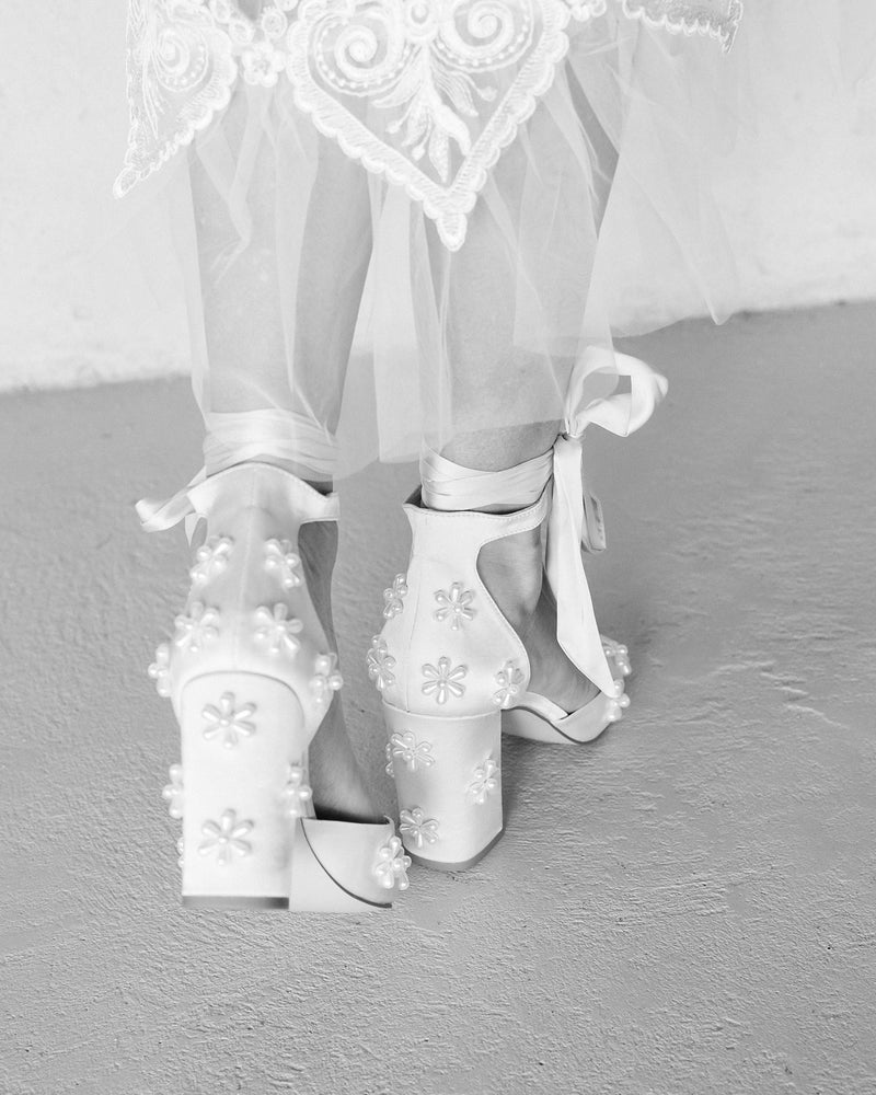 Pink satin bridal shoes with pearl daisies