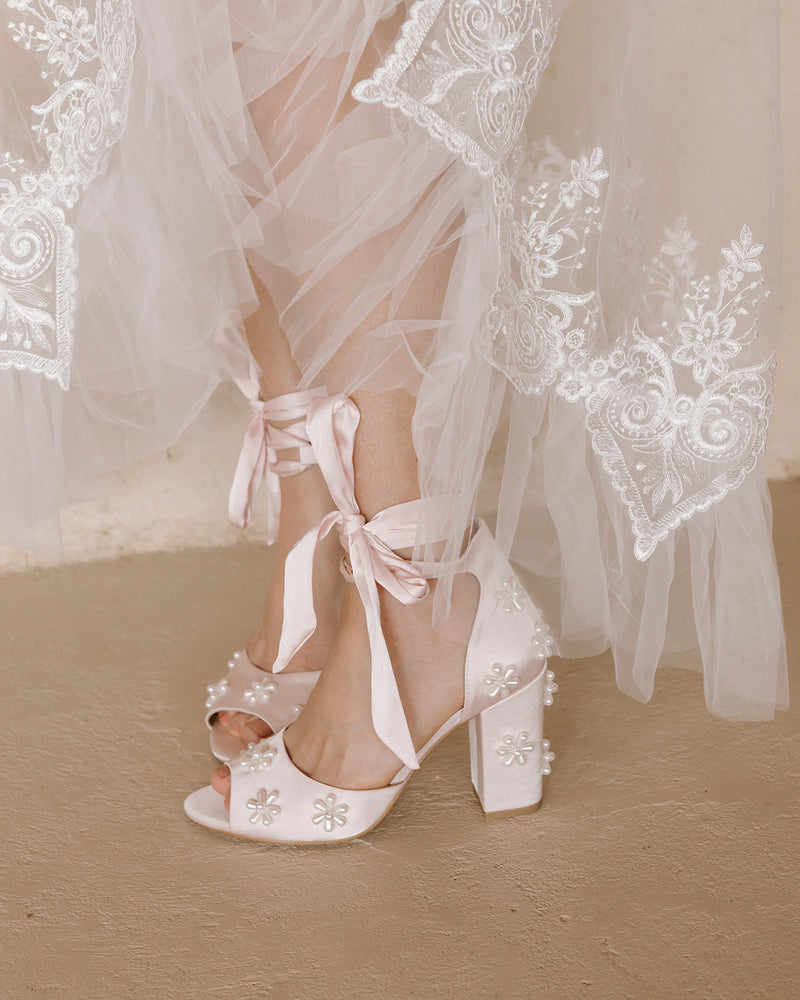 Pink satin bridal shoes with pearl daisies