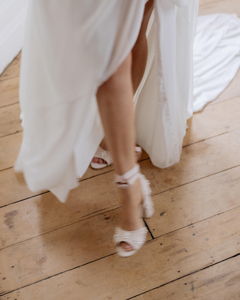 Pink satin bridal shoes with pearl daisy flowers