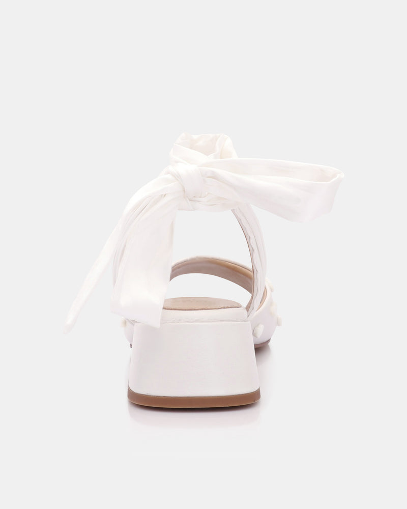 White sandal on a light gray background
