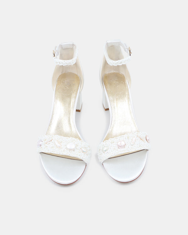 White high-heeled shoes on a white background