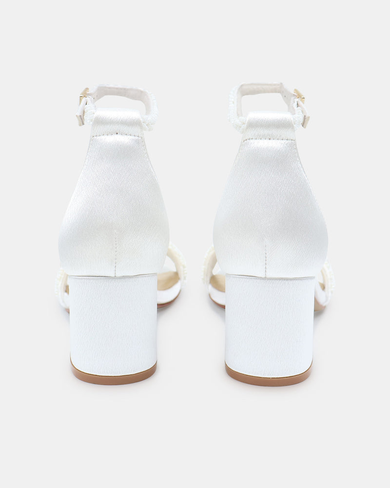 White high-heeled shoes on a white background