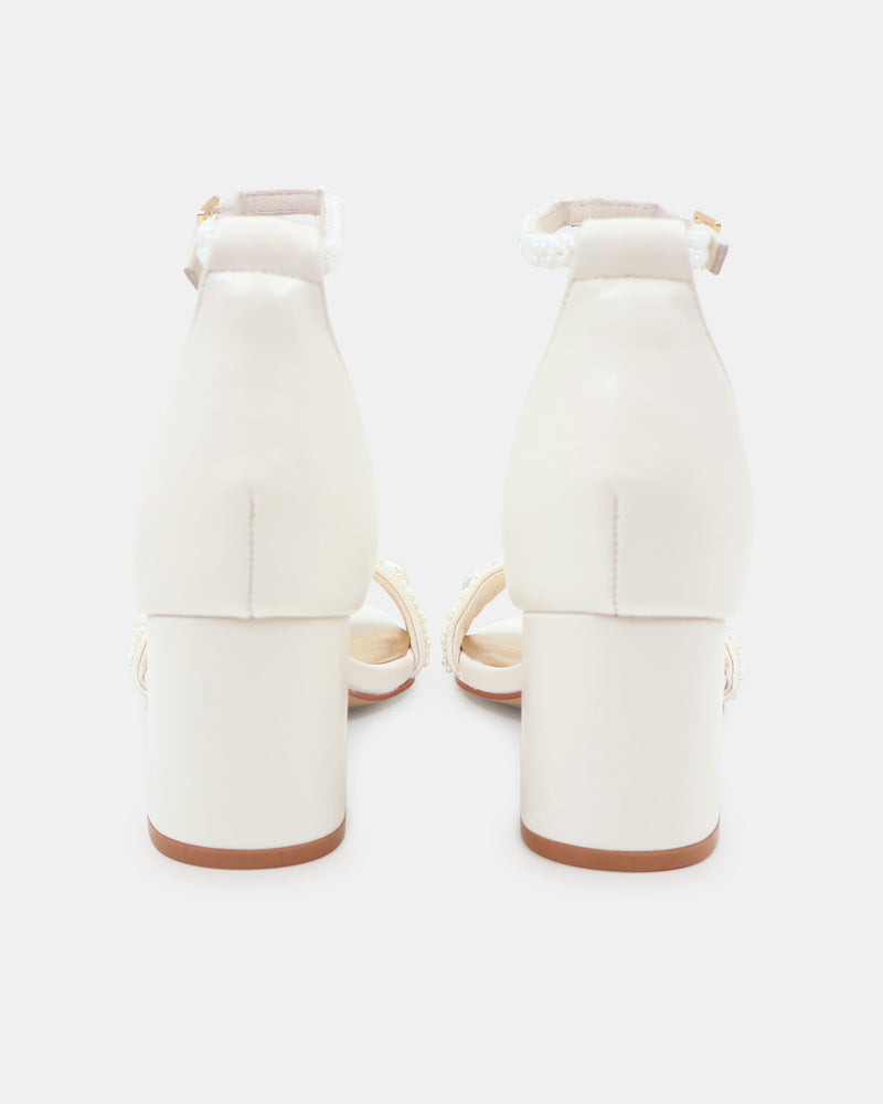 Pair of white high-heeled sandals on a white background