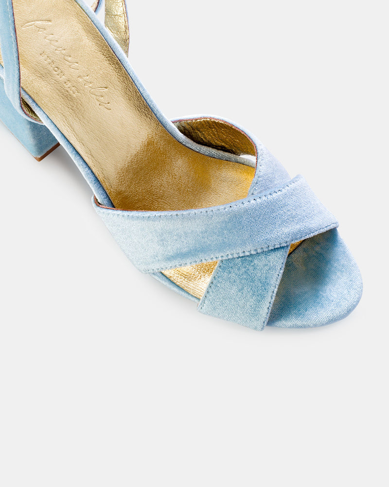 Light blue open-toe high-heeled shoe on a white background