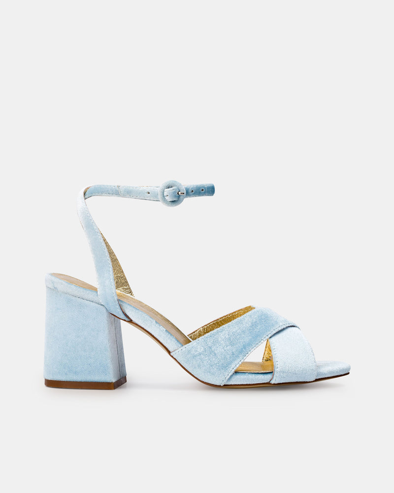Light blue sandal with a block heel on a white background