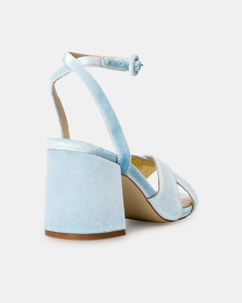 Light blue high-heeled sandals on a white background
