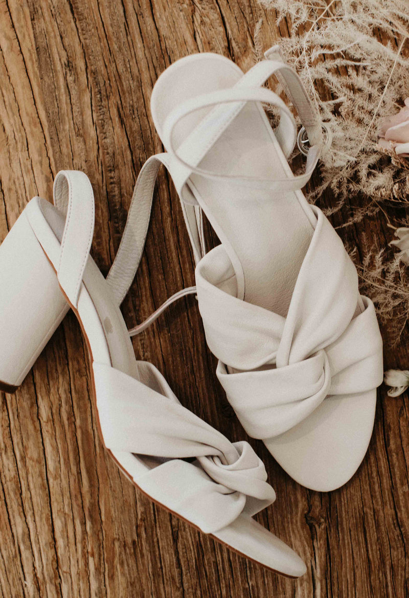 Ivory bridal shoes with cross front