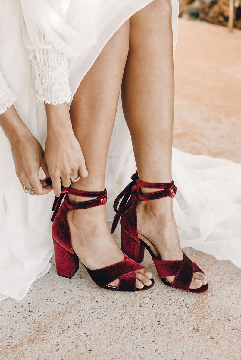 Red velvet bridal shoes with ruby red heels for the passionate bride